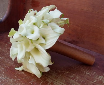For a themed wedding like fall weddings an orange calla lily bridal bouquet