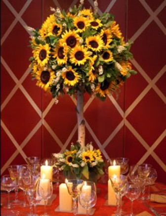 Even though tall white wedding centerpieces are traditional 