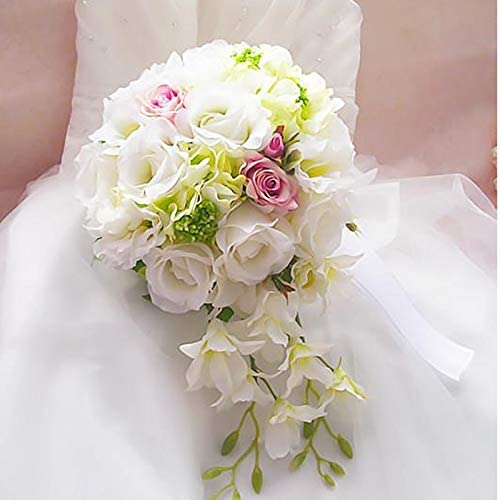 Bride with White and Ivory wedding bouquet with a touch of pink and green. Artificial silk orchids and roses.
