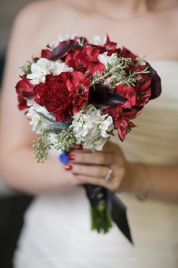 Bride Holding Beautiful Red and White Wedding Bouquet