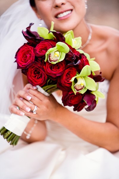 Bride with Stunning red and green bridal bouquet
