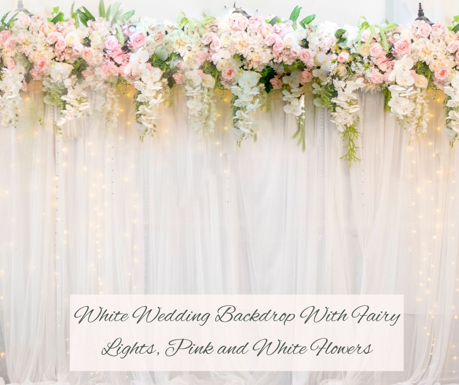White Wedding Backdrop With Fairy Lights, Pink Flowers and White Flowers