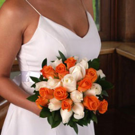 Bride holding White and Orange Roses Wedding Bouquet