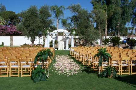 Pretty Outdoor Wedding Ceremony with Pink Flower Petal Aisle Runner