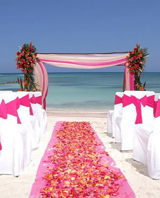 Pink Floral Wedding Aisle with White, Pink and Red Bridal Arch