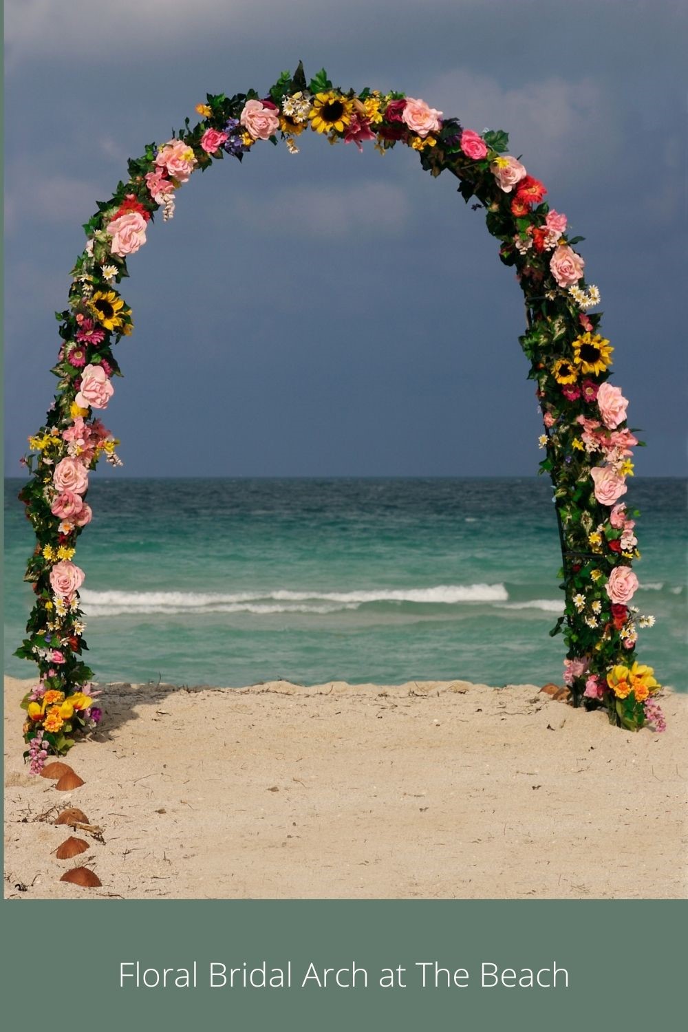 Pink, Yellow and Green Bridal Arch on the Beach