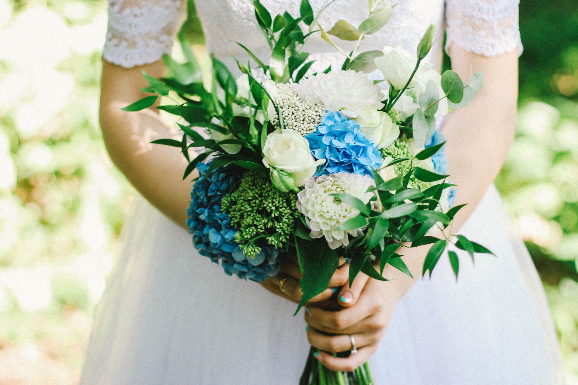 Bride with Pretty White, Blue and Green Bridal Bouquet