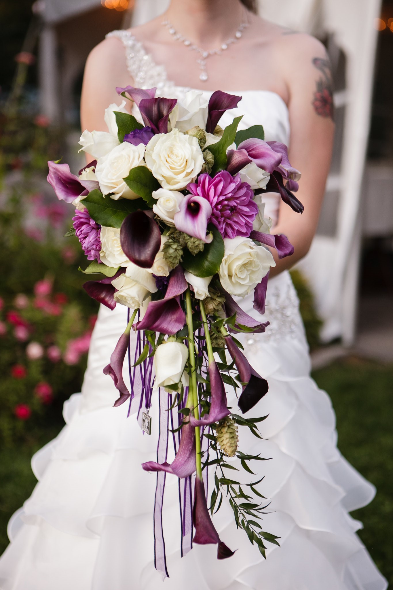 Bride With Purple and White Cascading Wedding Bouquet