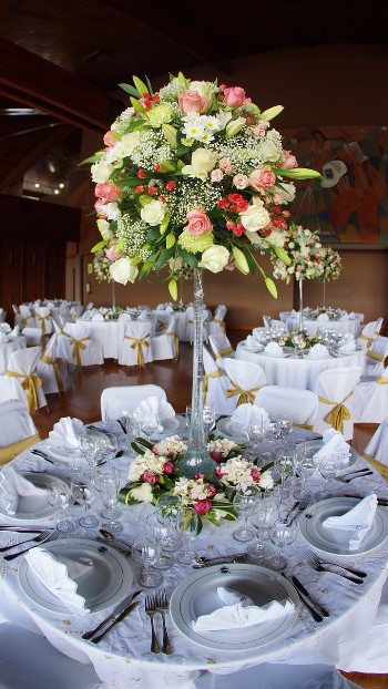 gorgeous yellow and pink tall wedding flowers for the centerpiece