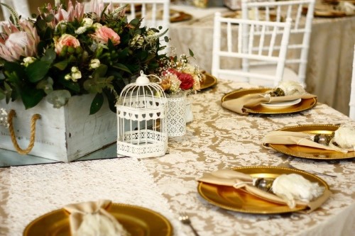 modern floral centerpiece with a birdcage accent