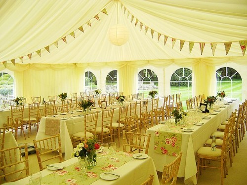 light green rectangle wedding tables in a lime green wedding tent