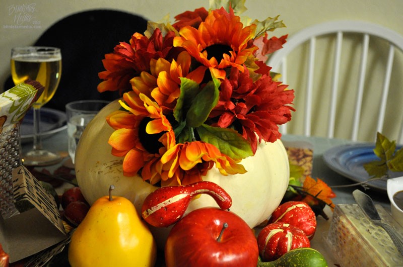 Unique Fall Wedding Centerpiece with White pumpkin, orange sunflowers and fresh fruit