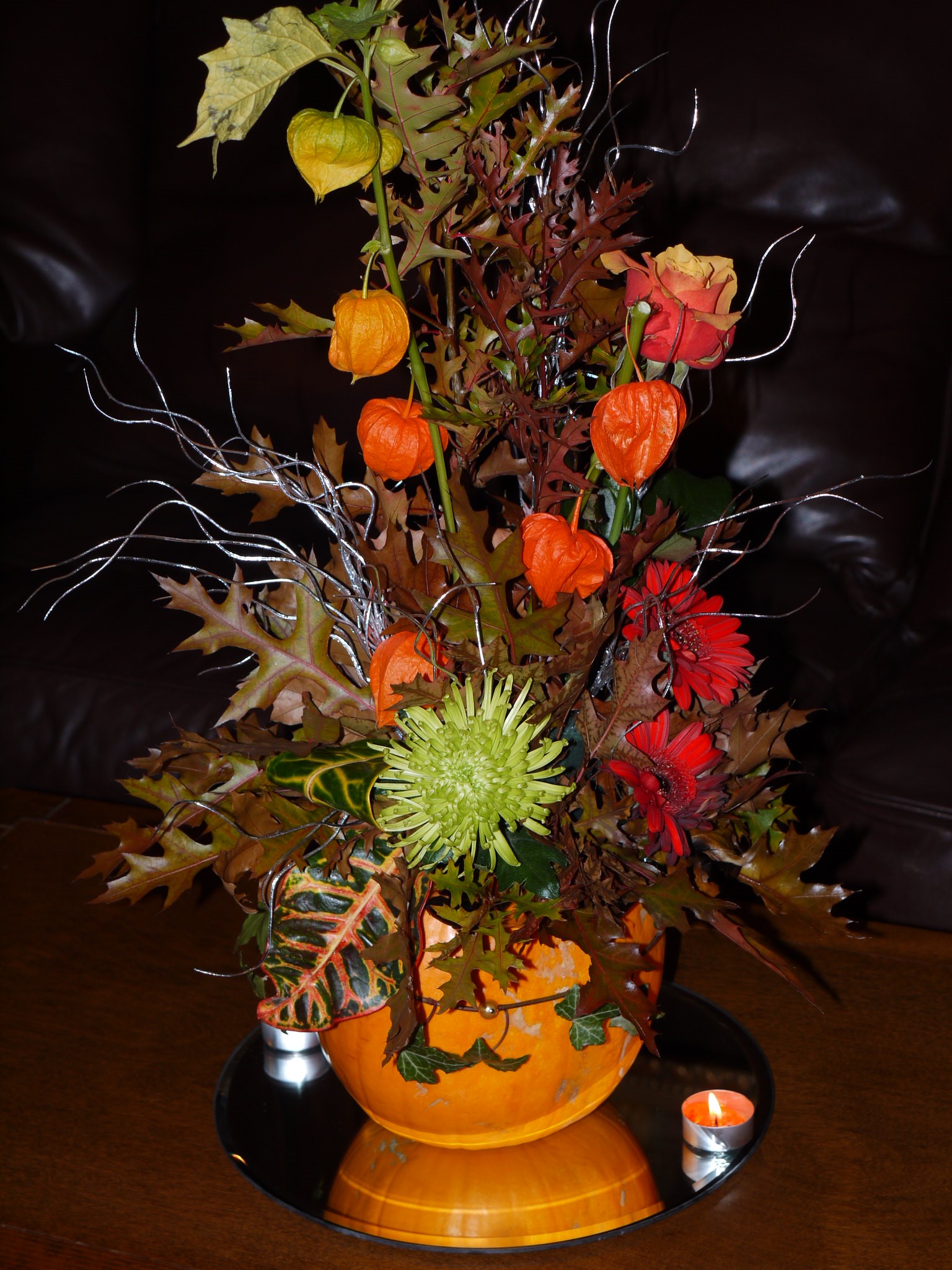 Beautiful Floral and Autumn Leaves Centerpiece inside of a Pumpkin