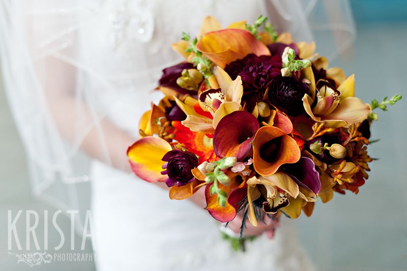Bride Holding Multi Colored Autumn Wedding Bouquets