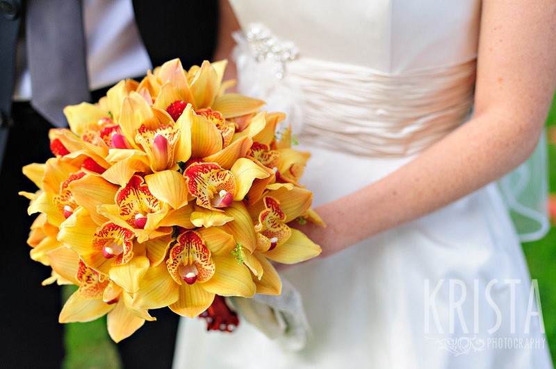 Bride with Stunning Yellow and Red Fall Wedding Bouquet