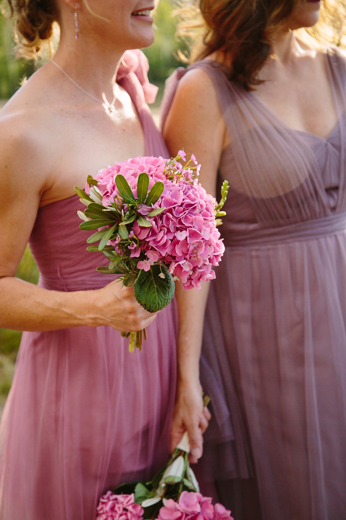 Bridesmaid in Pink holding a pink wedding bouquet