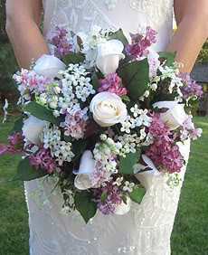 Bride Holding Gorgeous Purple, White and Green Cascading Wedding Bouquet