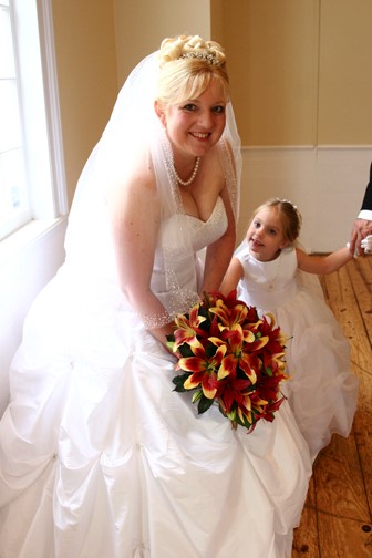 Bride with Amazing yellow, orange and green fall wedding bouquet