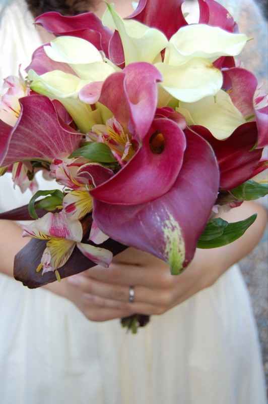 Bride with gorgeous yellow and purple wedding bouquet