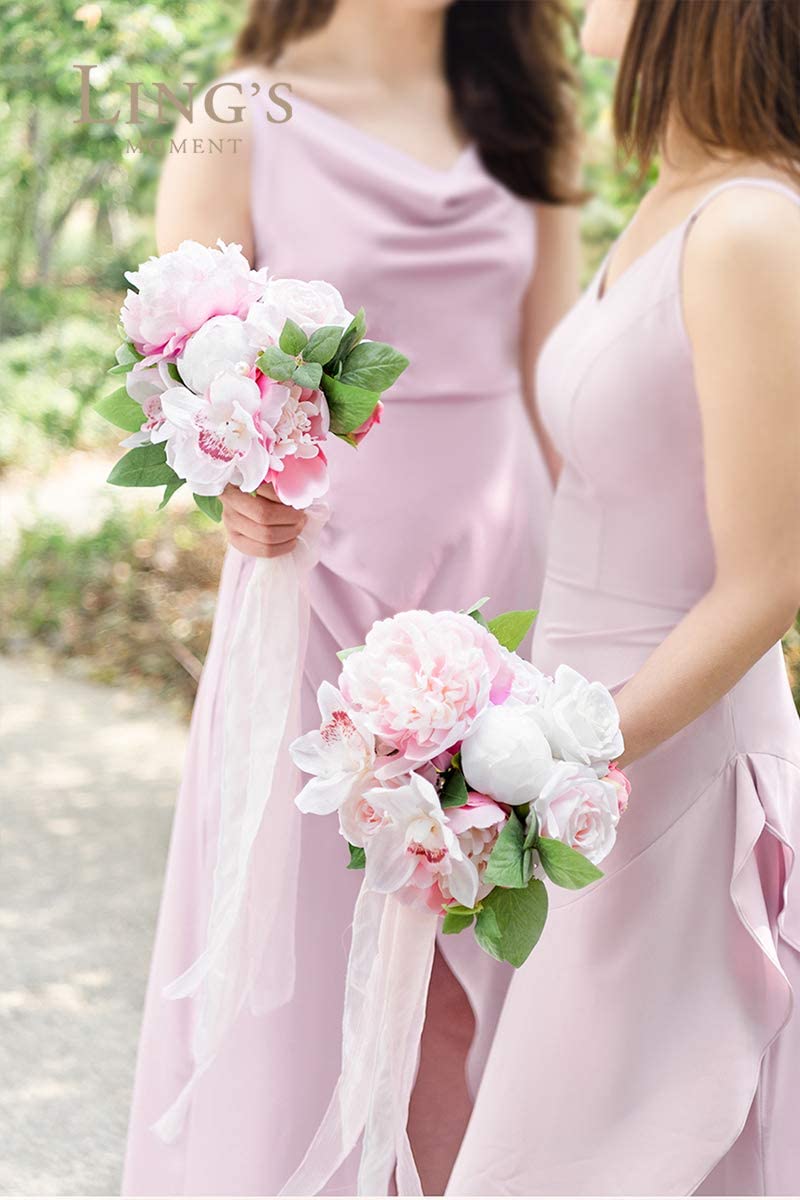 Bridesmaids holding romantic vintage soft pink wedding bouquets