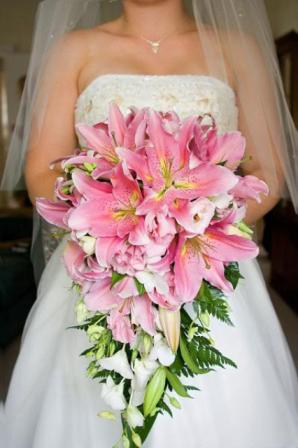 Bride Holding Pink and Green Cascading Wedding Bouquet