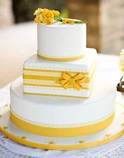 summer wedding cake, yellow wedding cake, white and yellow wedding cake, wedding cake with bows and flowers