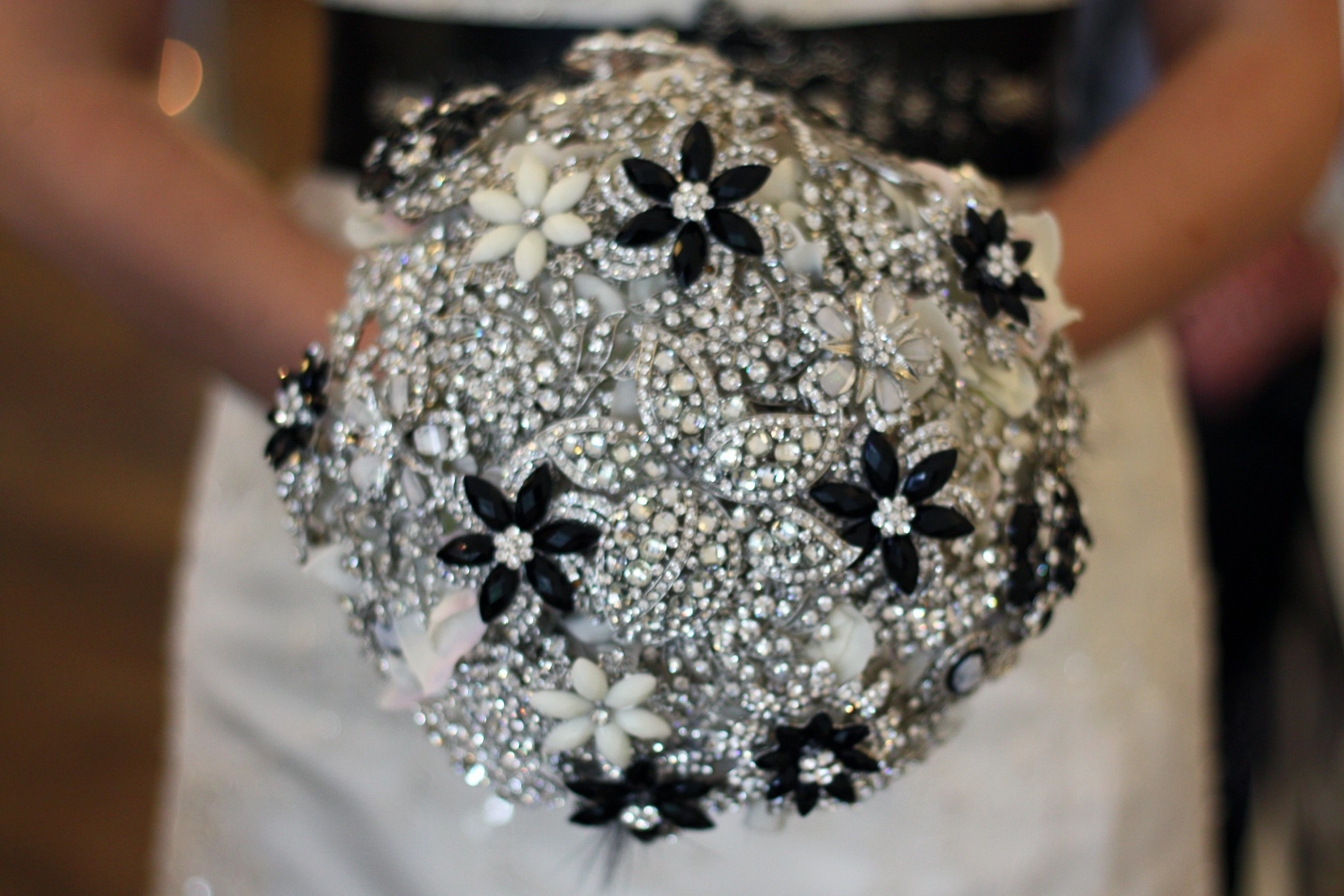 Bride Holding Black, White and Silver Jeweled Wedding Bouquet