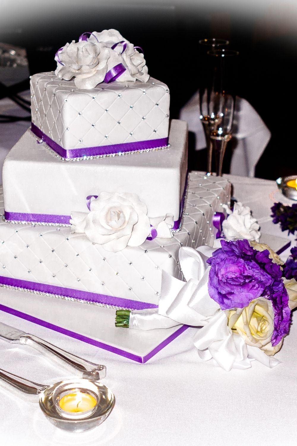 modern purple and white wedding cake
