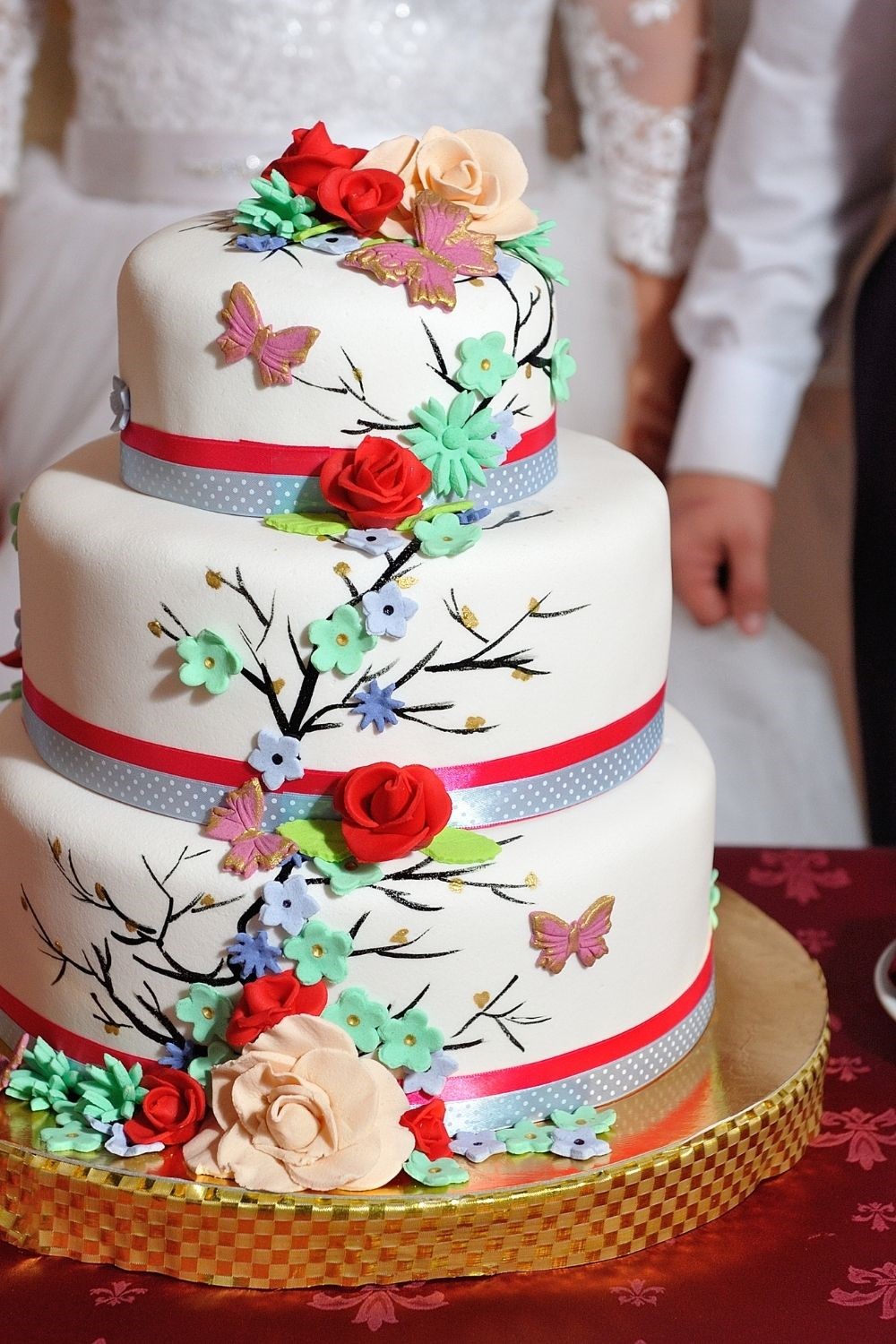 red, green and pink butterfly wedding cake