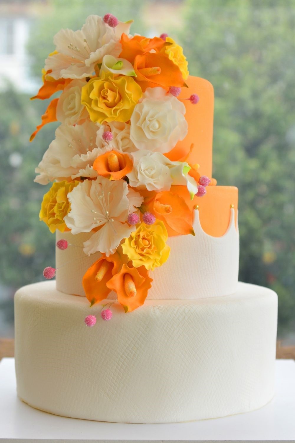 tropical orange, yellow and white wedding cake