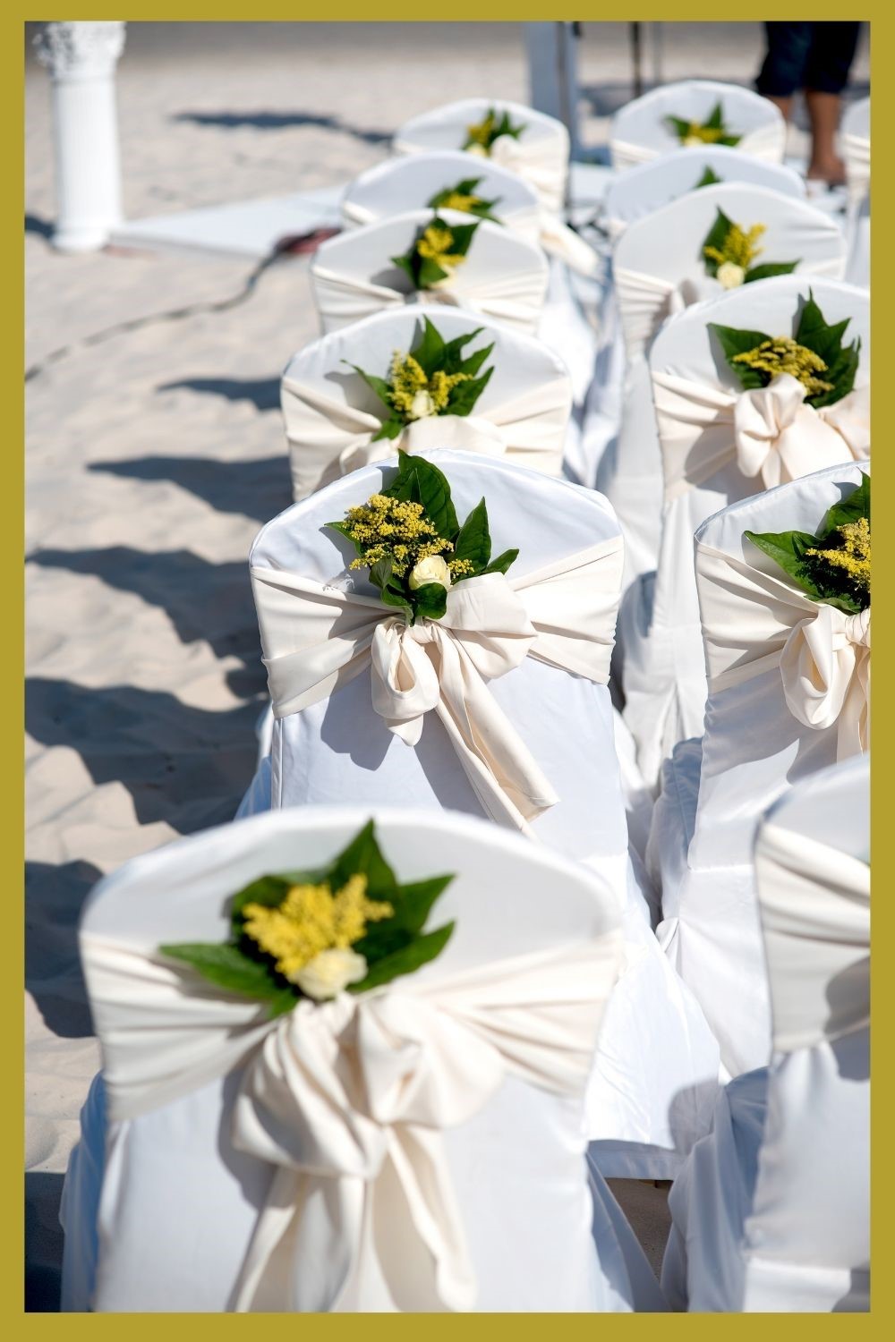 white outdoor wedding chairs with yellow bouquets