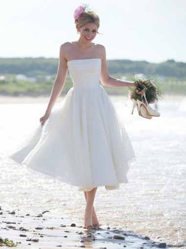 Bride wearing a lovely A-Line Strapless Tea Length Chiffon Beach Wedding Dress