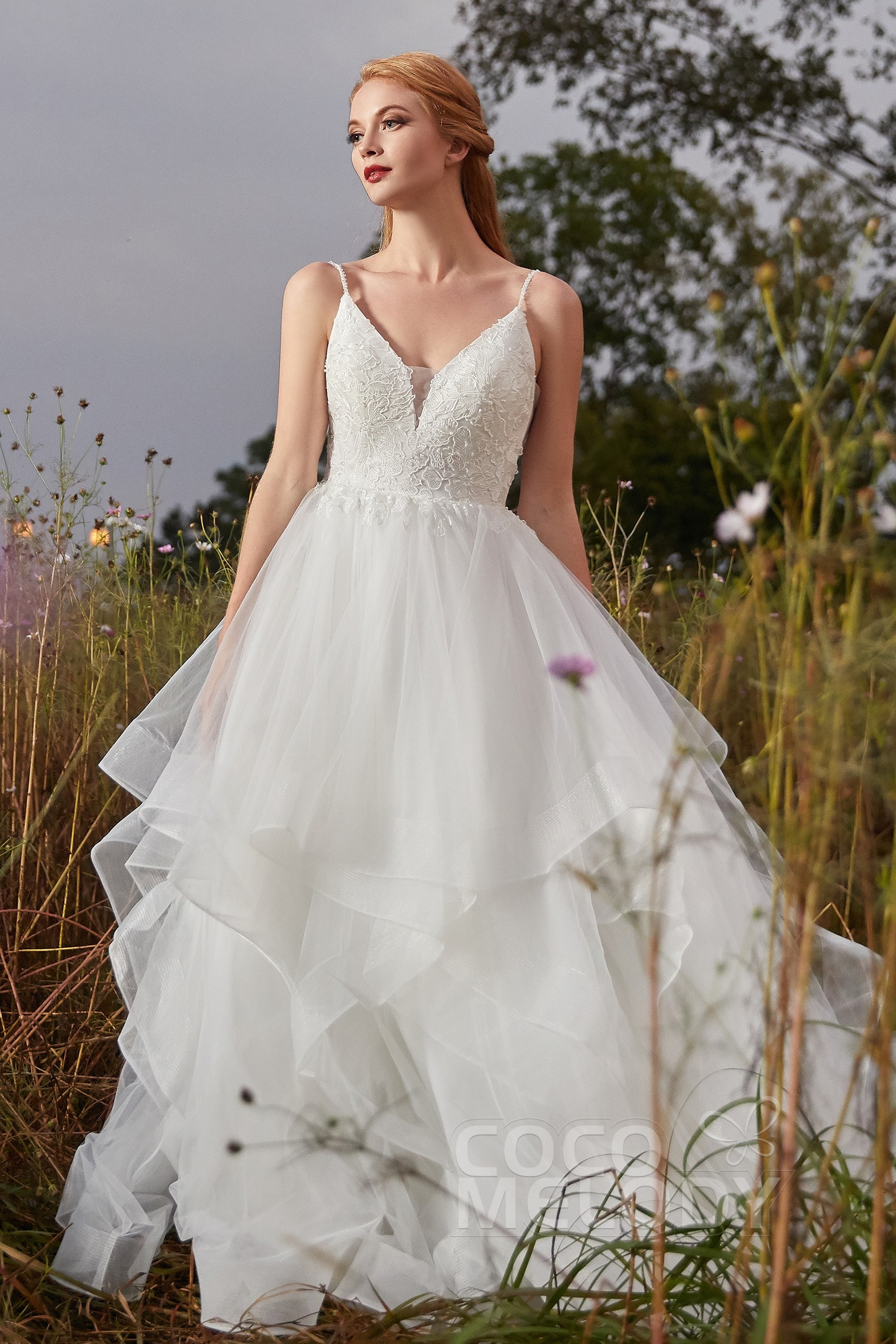 Bride in a beautiful A-Line Court Train Tulle Wedding Dress