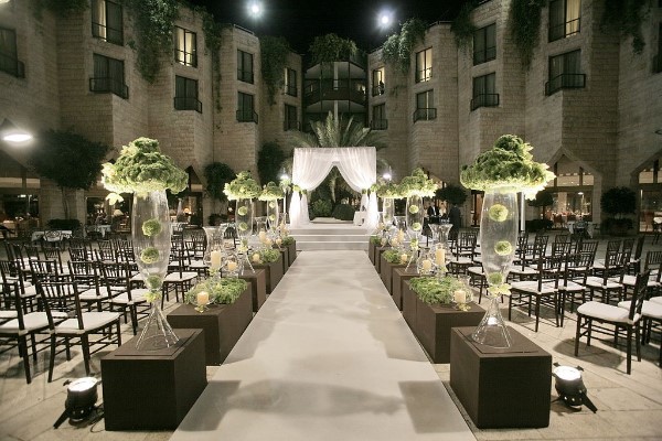 unique wedding aisle with flowers and Floor urns