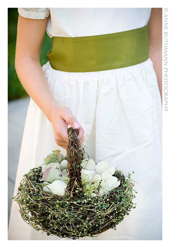 Flowergirl with unique Green Flower Girl Basket and white and pale green petals
