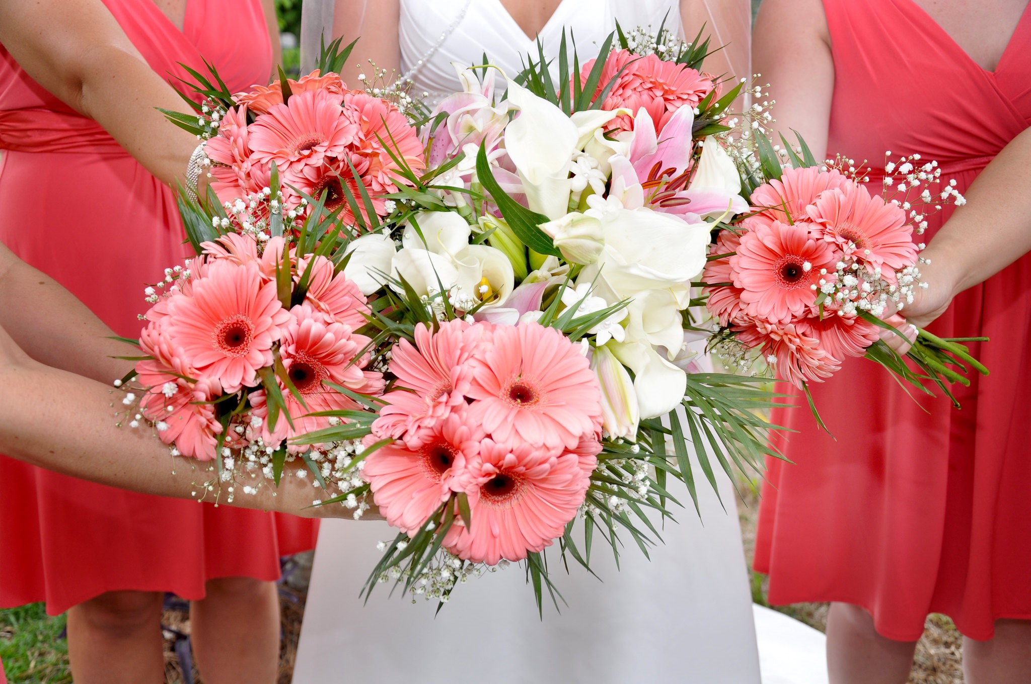 Bride and Bridesmaid With bouquets - Bride in white with white bouquet, bridesmaid in pink with pink bouquets